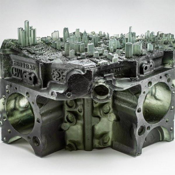 piece of glasswork: Detroit skyline cast in glass and place atop a V8 engine